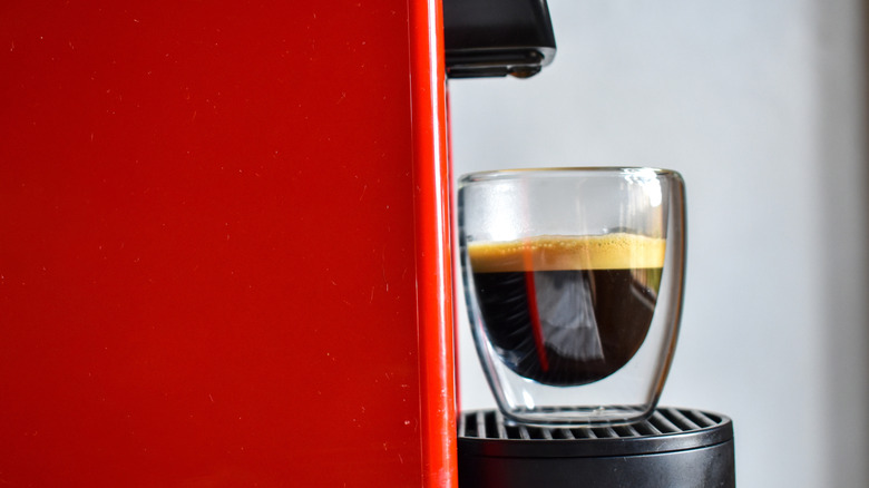 A red Nespresso machine.