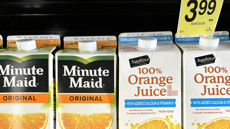 Orange juice cartons on a grocery store shelf