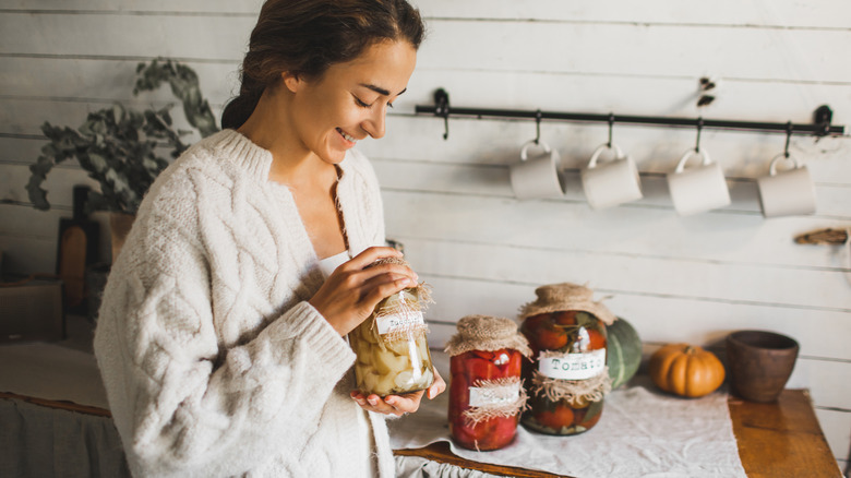 Person holding jar of fermented vegetables