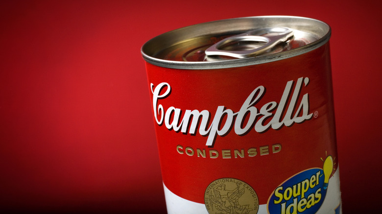 Campell's soup can against red background