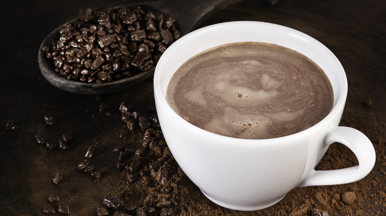 A chocolate latte and chocolate candies