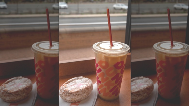 Dunkin' chocolate iced coffee with donut on side