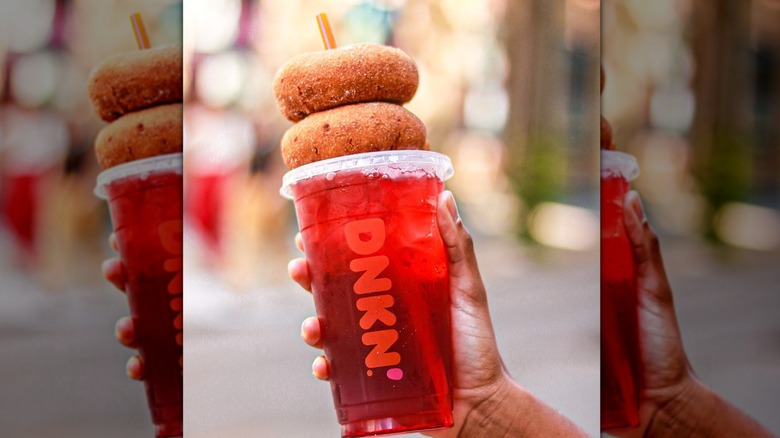 Person holding Dunkin' Cranberry Apple Refresher