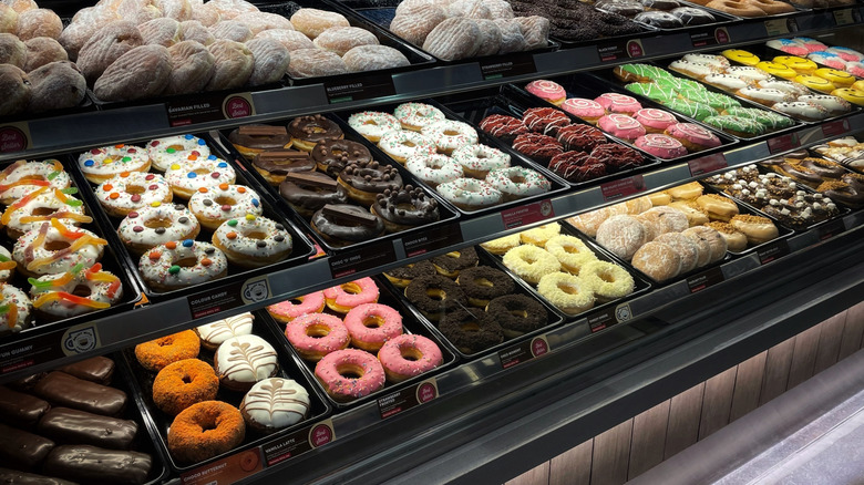 A variety of donuts on display at a Dunkin'  location.