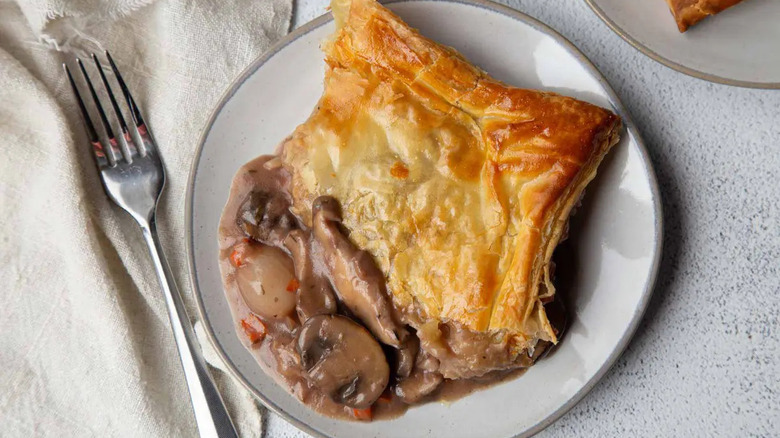 Mushroom pot pie slice on plate