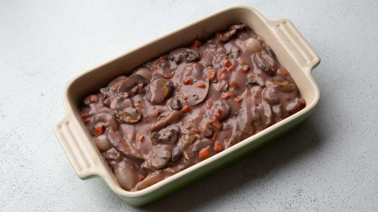 Mushroom pot pie filling in rectangular baking dish