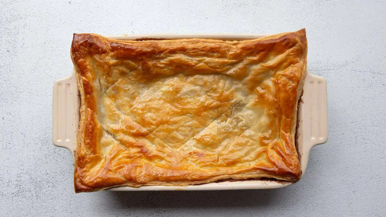 Golden pastry crust on top of baking dish