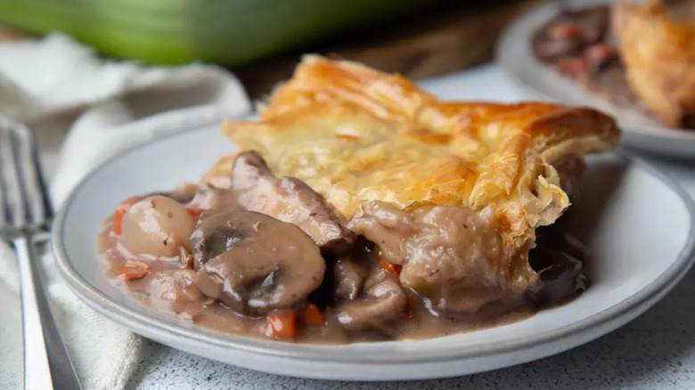 Mushroom pot pie slice on plate