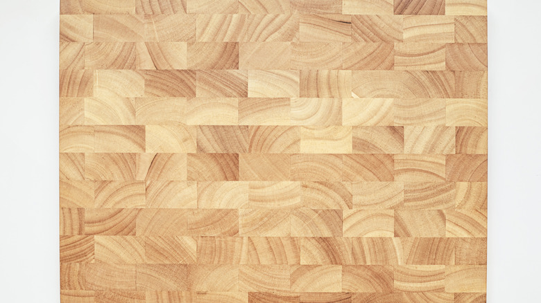 An end-grain cutting board on a white background.