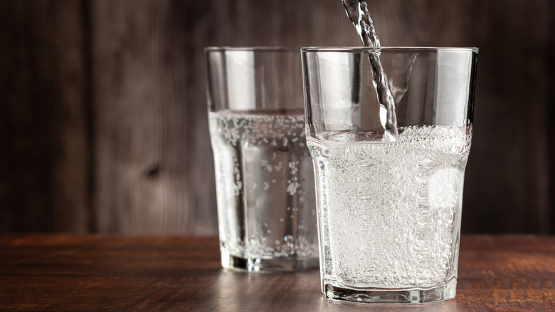 Carbonated water pouring into glass