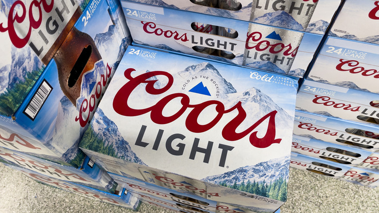 Cases of Coors Light stacked in a store