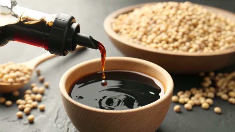 Soy sauce being poured into a bowl