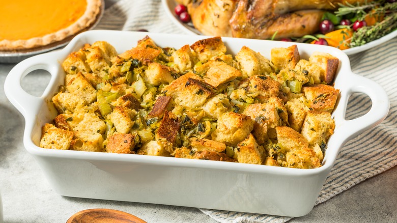 thanksgiving stuffing with pie in background