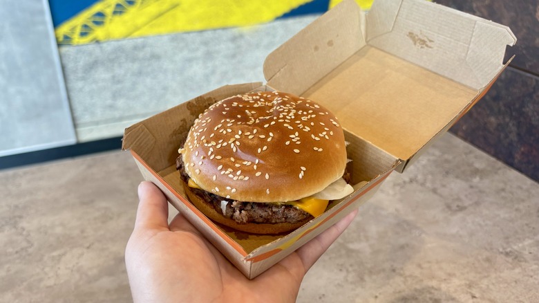 Handheld Quarter Pounder with Cheese in its box