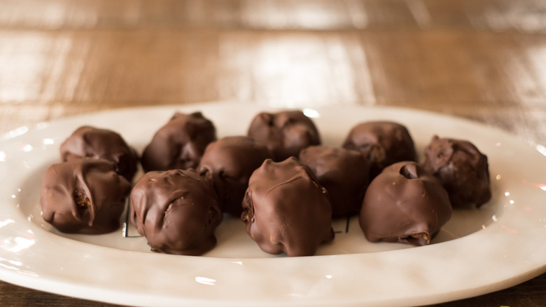 closeup of bourbon balls on white plate