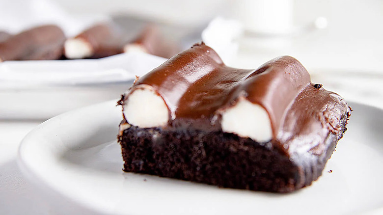 closeup of a slice of bumpy cake on white plate