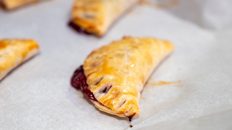 closeup of hand pie on parchment paper