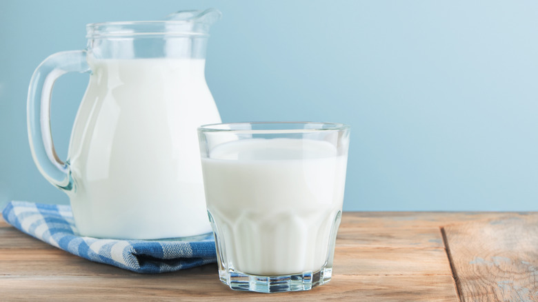 Glass and pitcher of cow's milk