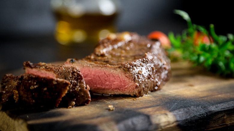 Cut steak on cutting board