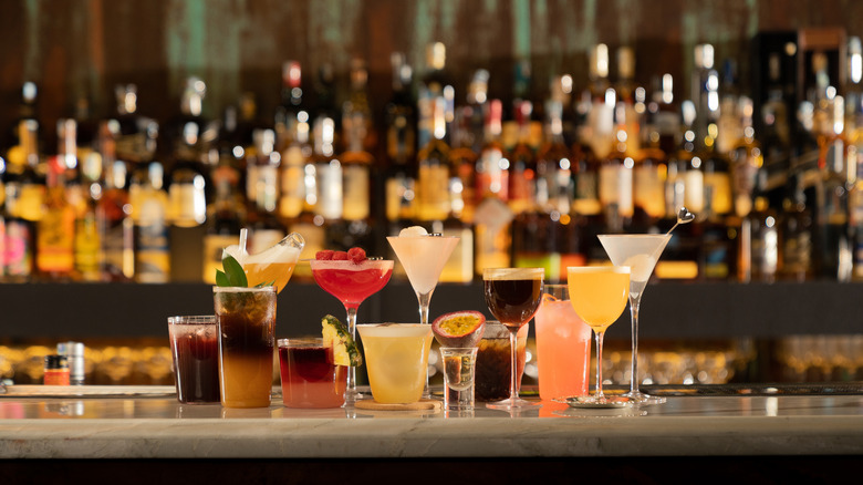 Multiple cocktails on bar countertop