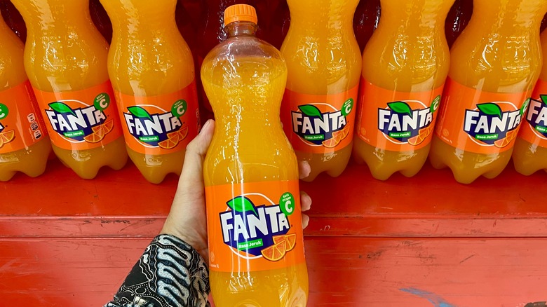 Row of plastic Fanta bottles