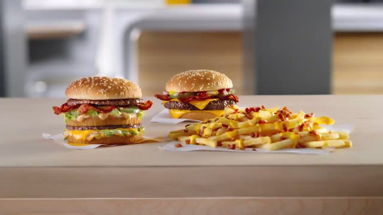 Two McDonald's burgers and fries with bacon