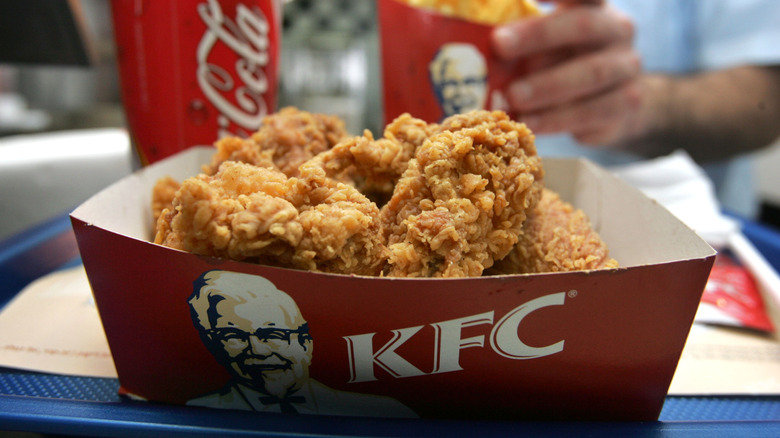 KFC fried chicken in red box with fries and soda