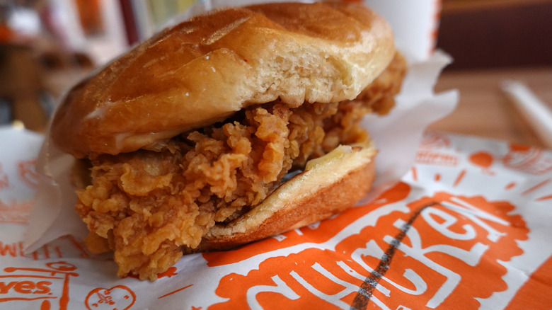 Popeyes chicken sandwich on wrapper