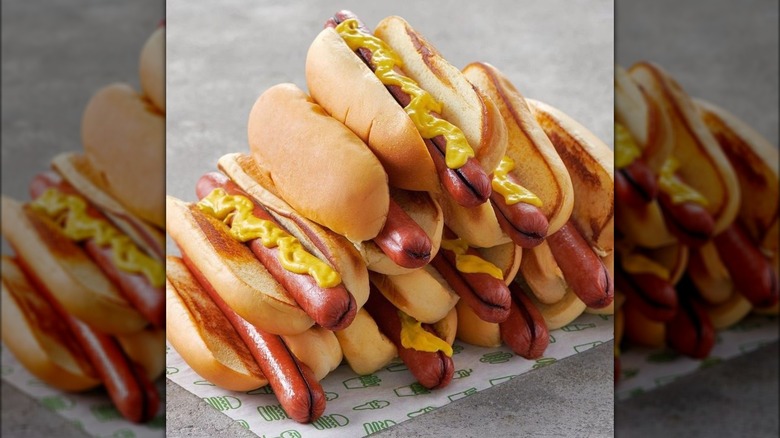 Stack of hot dogs with mustard