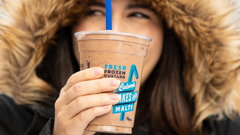 Woman holding Culver's milkshake