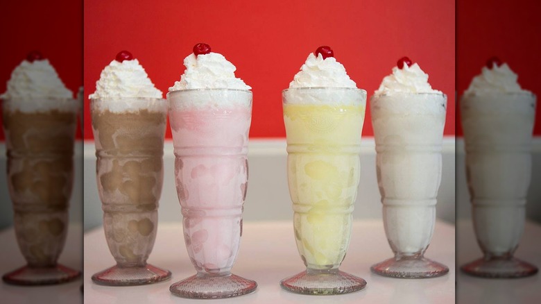 Four milkshakes in glasses