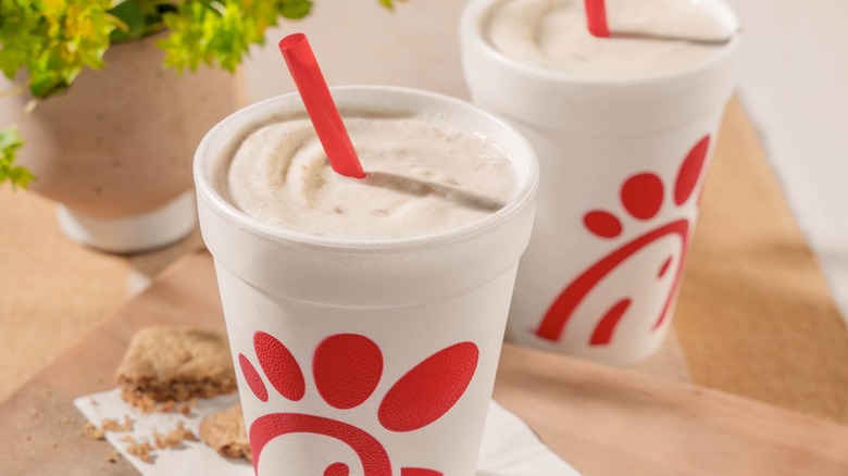 Two Chick-fil-A milkshakes with straws