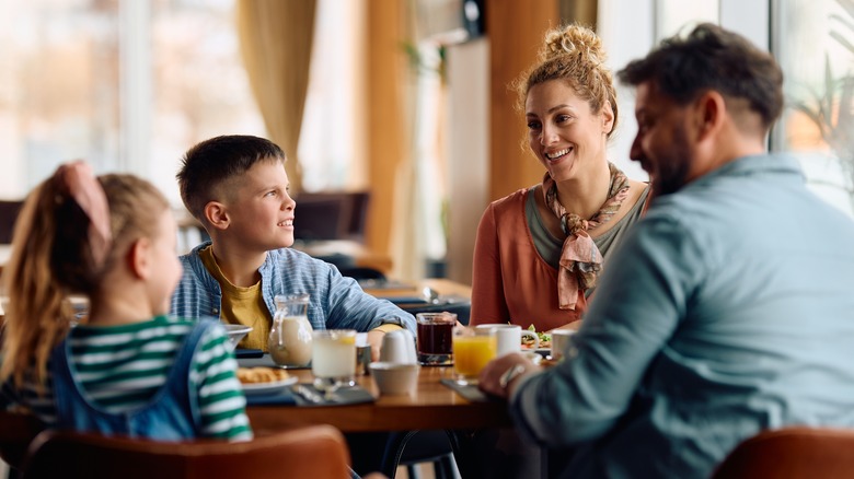 Family eating breakfast at restaurant