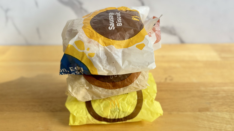 Stacked wrapped fast food breakfast sandwiches