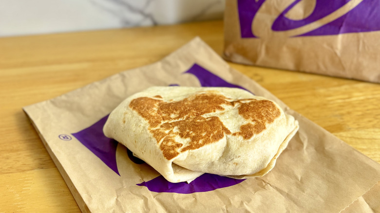 Taco Bell Breakfast Crunchwrap Sausage on its wrapper