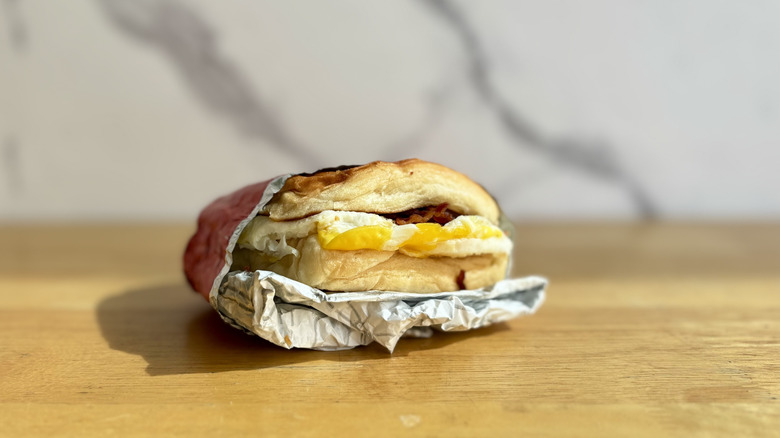 Wendy's Bacon, Egg & Swiss Croissant on a wooden surface