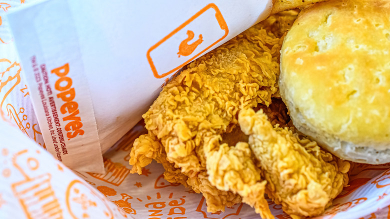 Popeye's box with chicken and biscuit