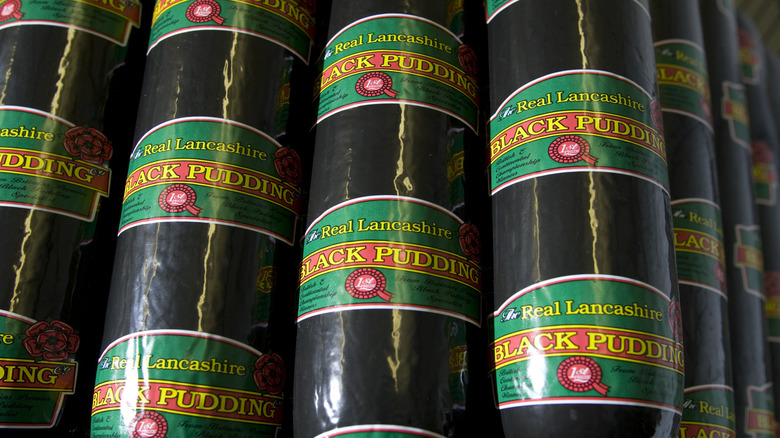 Stacked chubs of black pudding