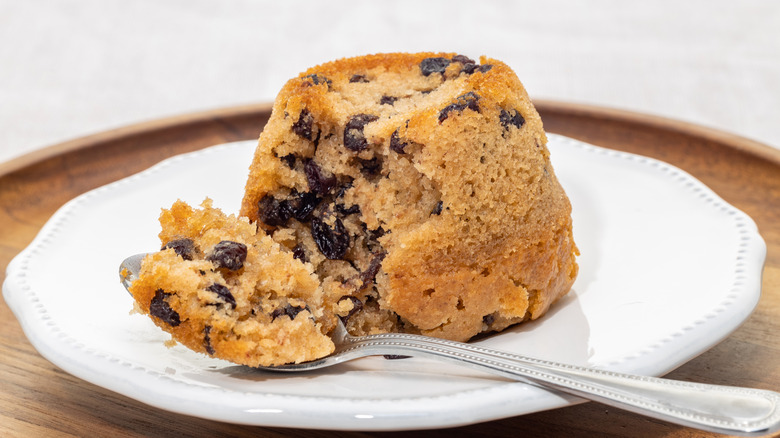 Spotted dick pudding on plate