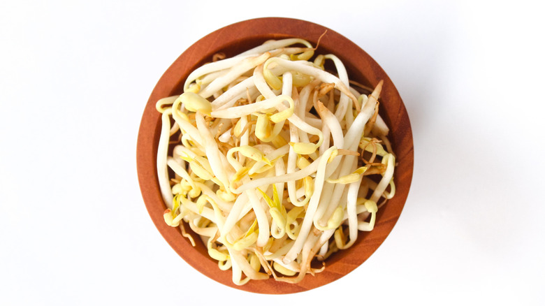 Fresh sprouts in wooden bowl