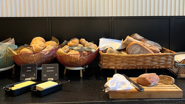 Varied breads displayed on buffet countertop