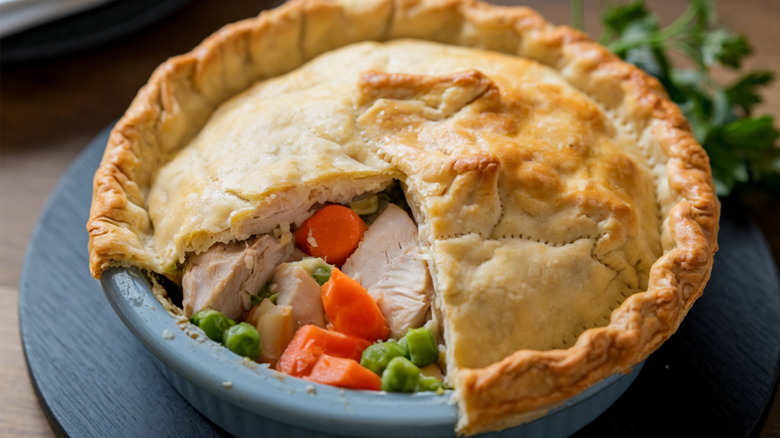 Chicken pot pie with a wedge of crust removed