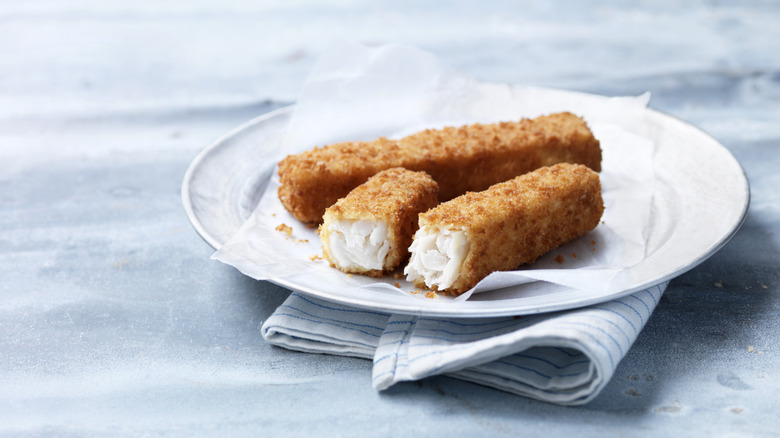 A plate with three fish sticks