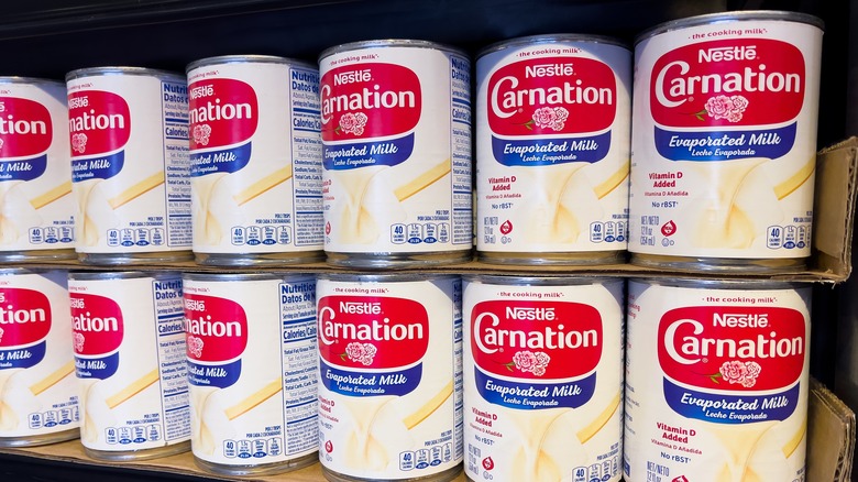 cans of evaporated milk on store shelf