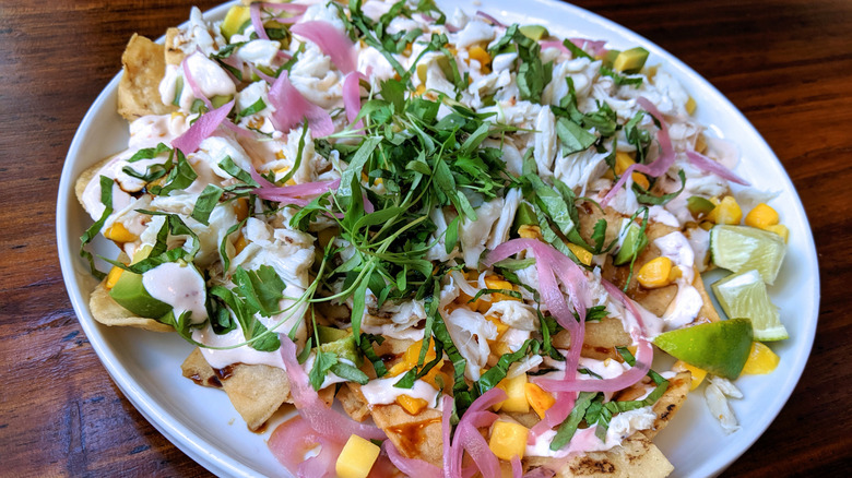 Large plate of nachos with crabmeat