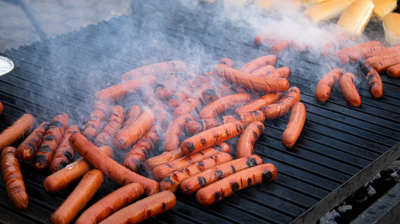 hot dogs on a grill