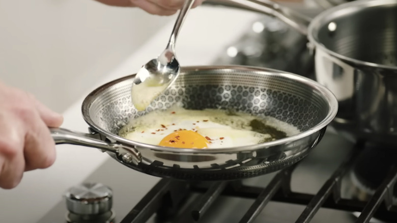 Basting a fried egg