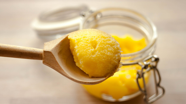 Ghee or clarified butter on a spoon