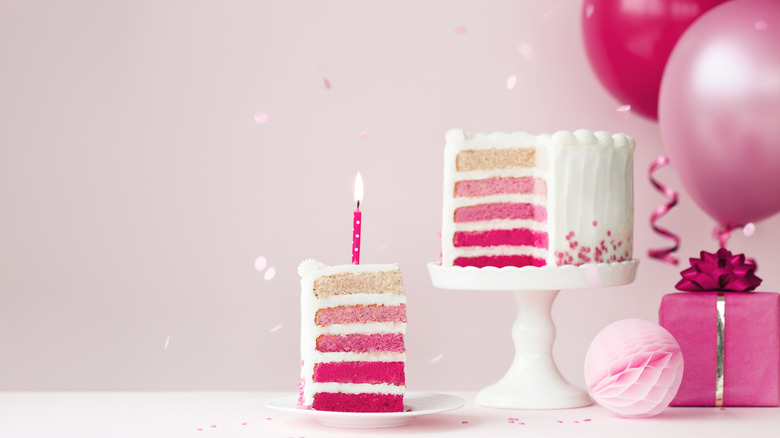 pink and white ombre cake decorated with roses