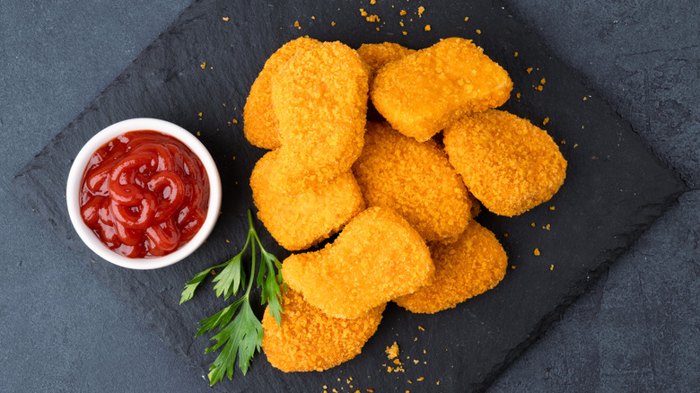 Chicken nuggets on a stone slab